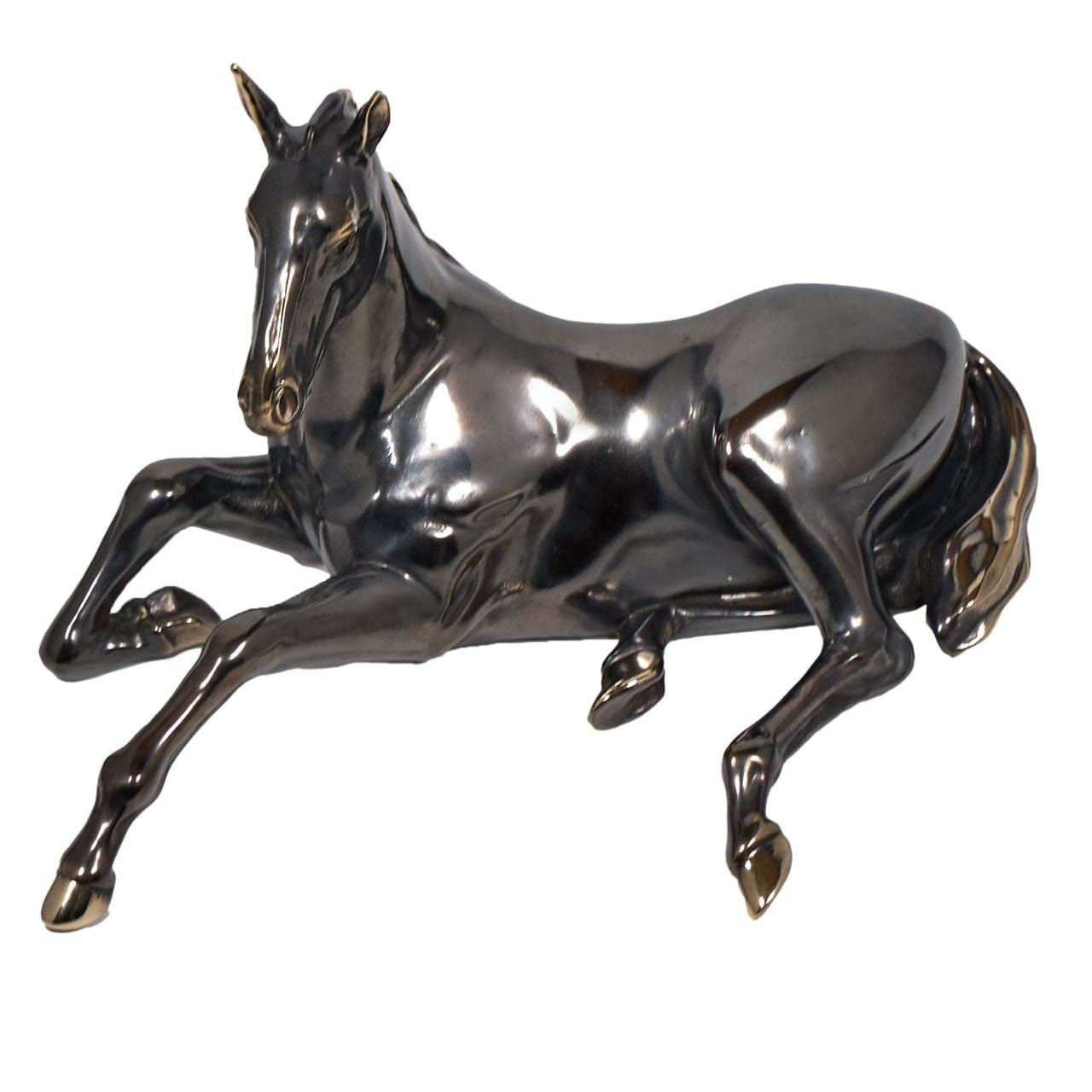 100% hand crafted bronze sculpture of a lying horse. Patinated bronze, 20 cm.